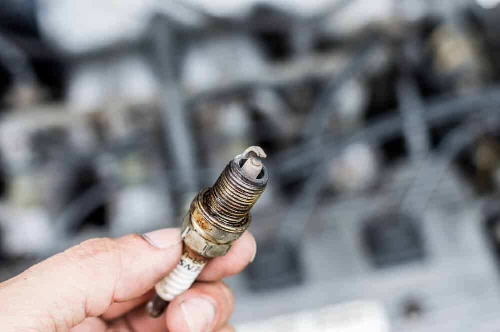 oil on spark plug threads